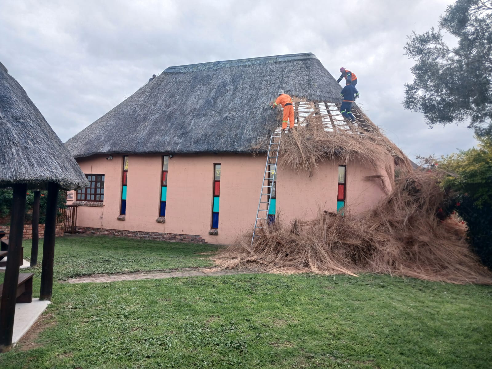 Thatch removal in progress at Greenfountain Resort