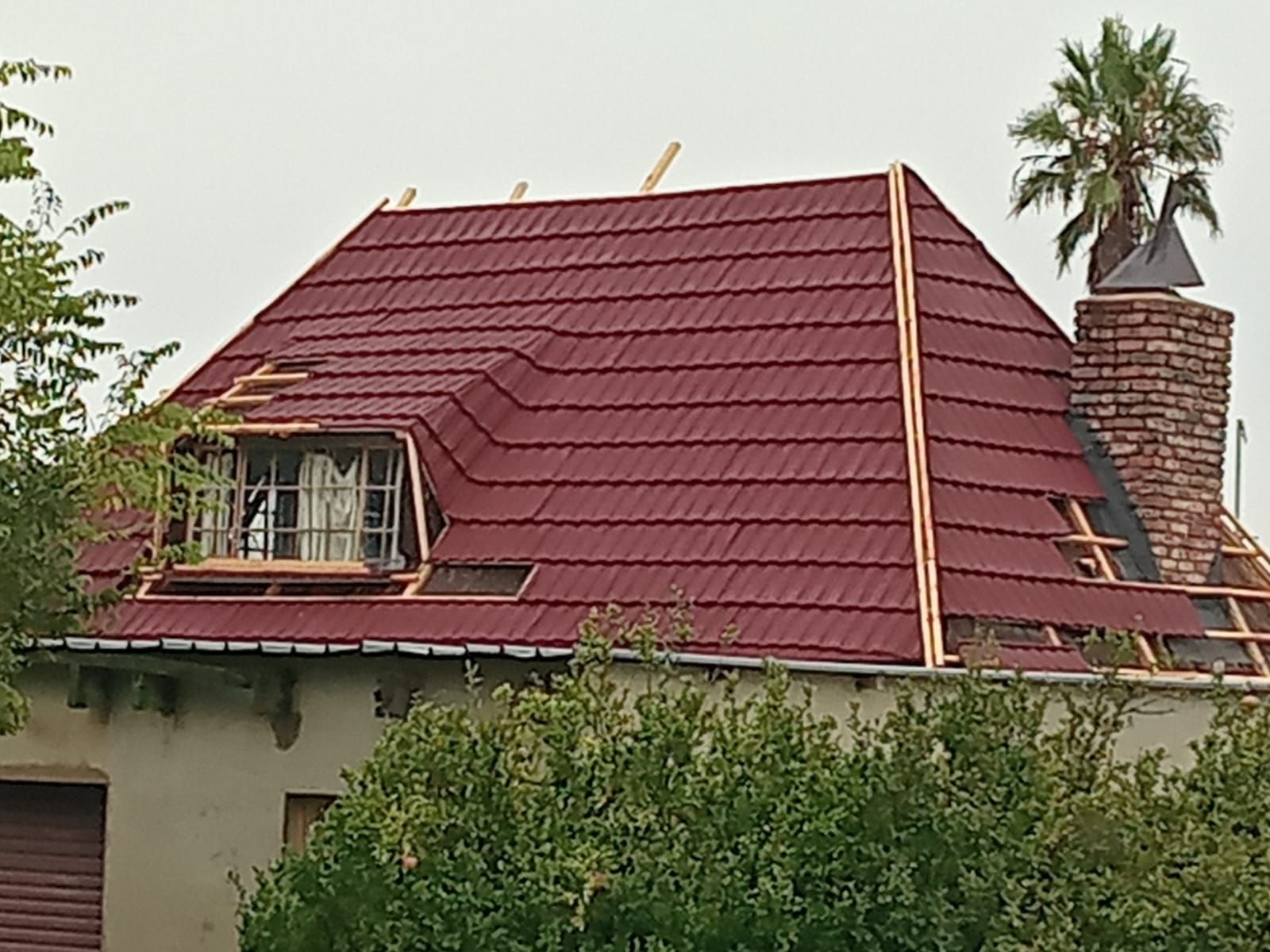 Finished red roof sheeting and ridge details